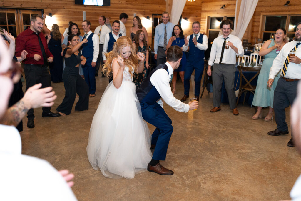 Groom dances on his new wife at their wedding party!