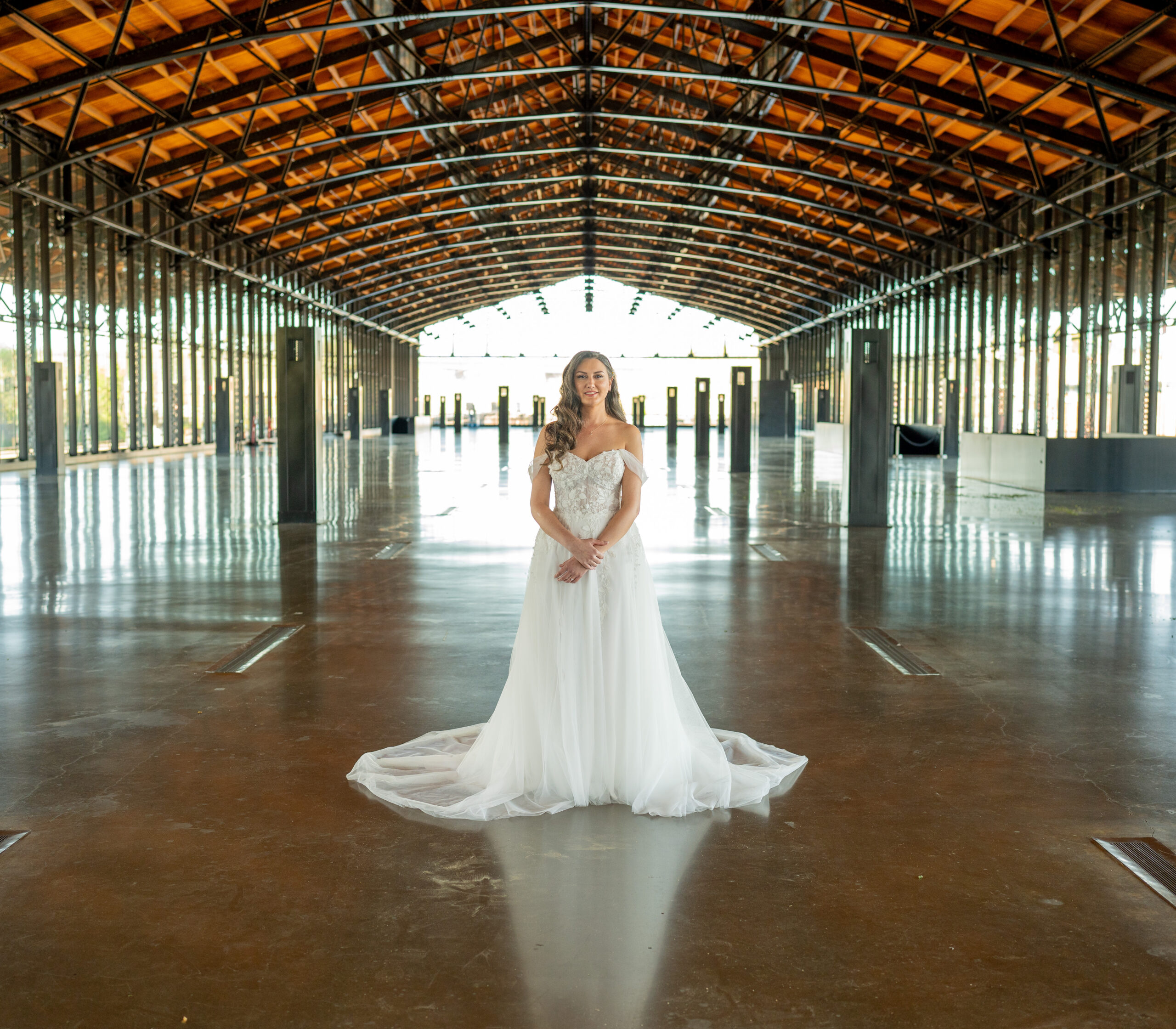 A bride during her wedding day in her dress posing for her solo bridal portraits.