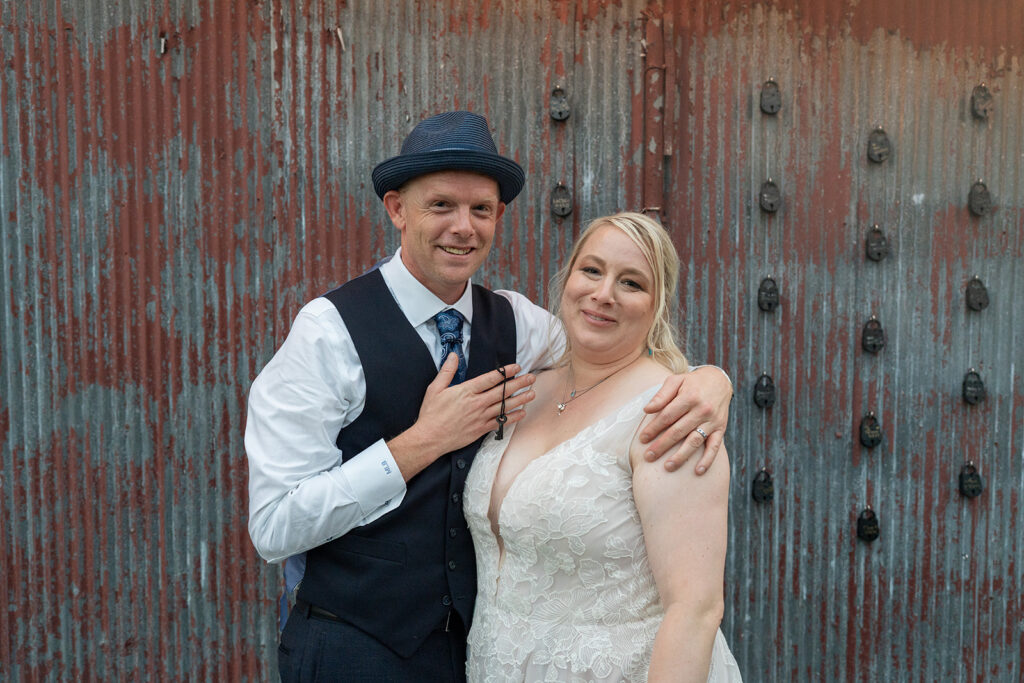 Barns of Kanak wedding - couple at lock wall holding key