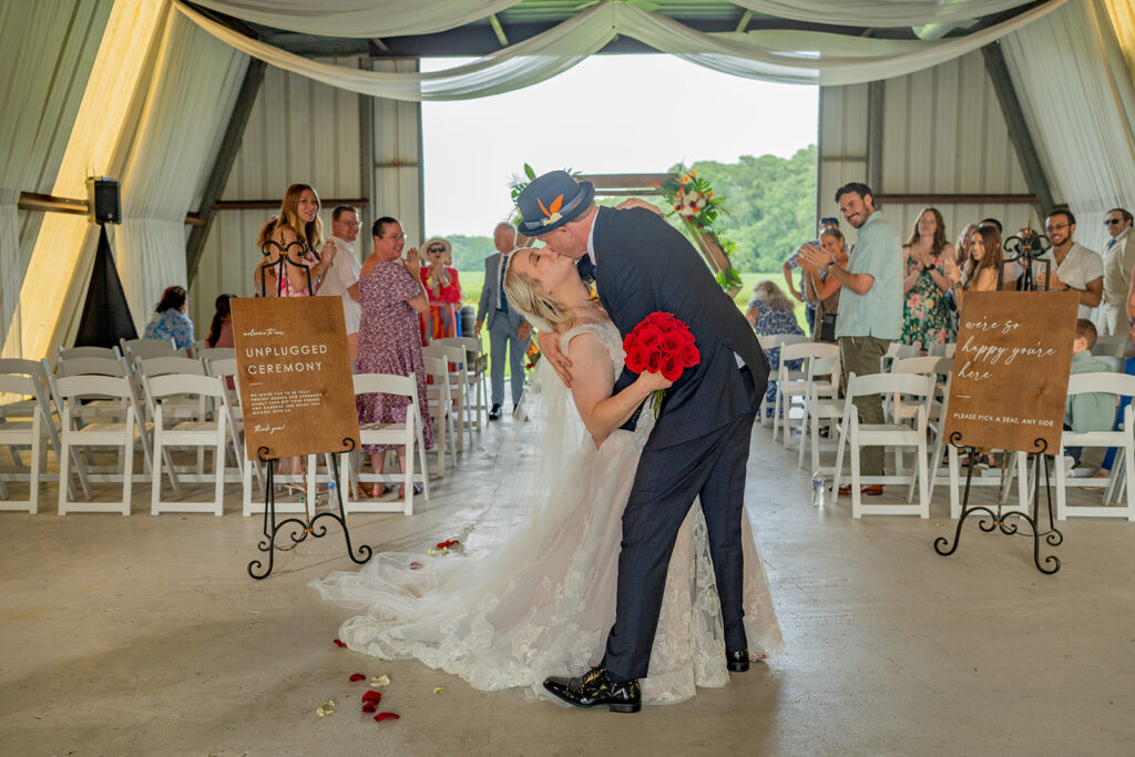 Barns of Kanak wedding photographer - dip kiss recessional Metal Barn ceremony