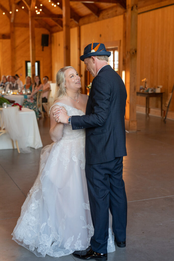 Barns of Kanak wedding - first dance reception barn wood beams bistro lights