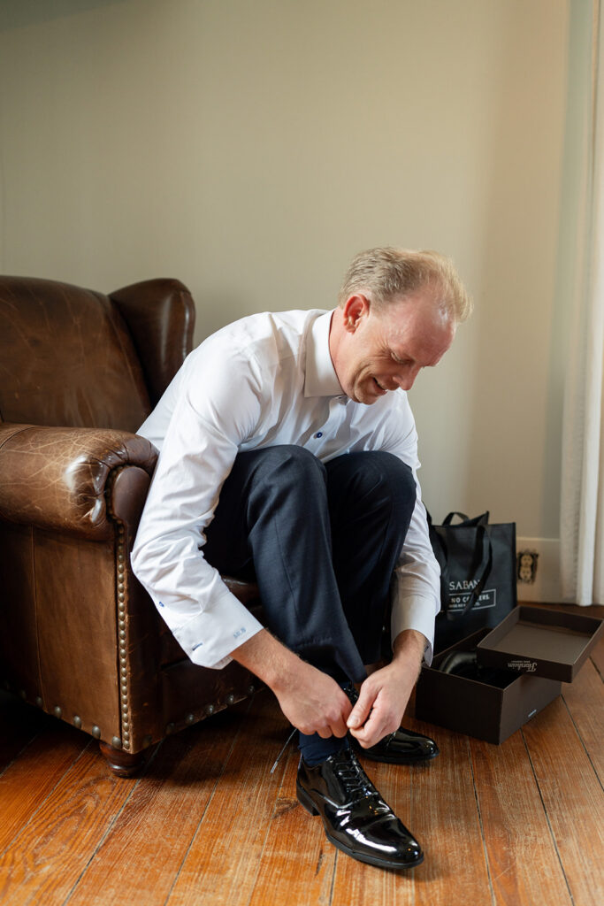 Barns of Kanak wedding - groom getting ready in grooms room Prince George VA