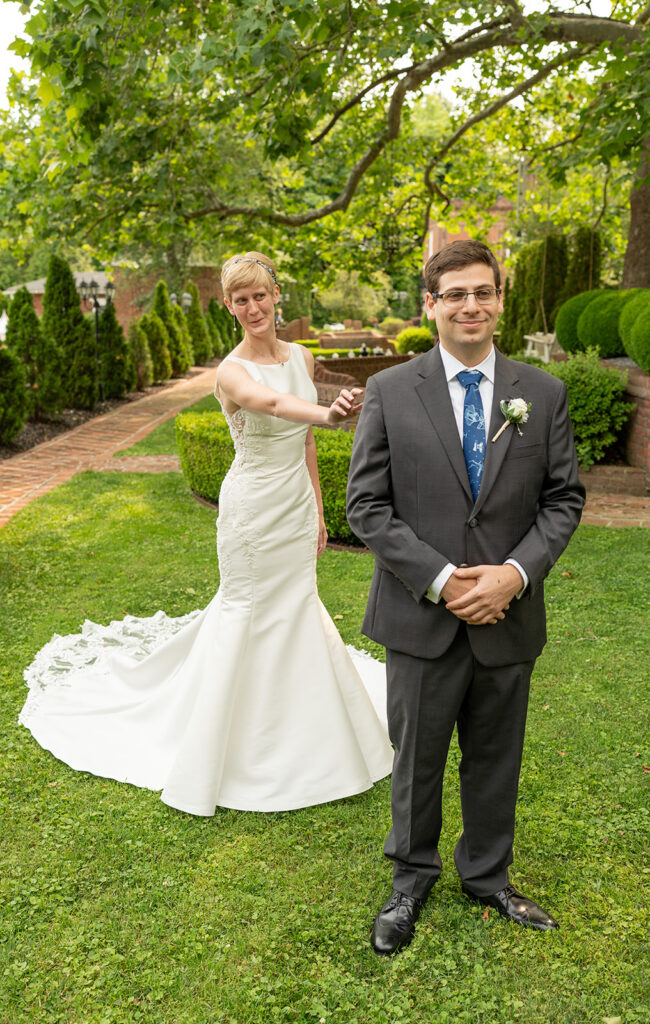 First look between bride and groom on the lawn at Mankin Mansion in Richmond, VA, candid wedding photography by Mason Jesmer
